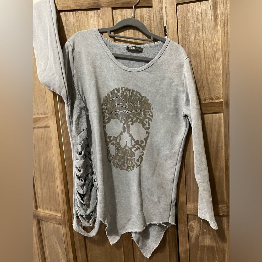 EUC.  CCK skeleton raw edge crewneck criss-cross cut out